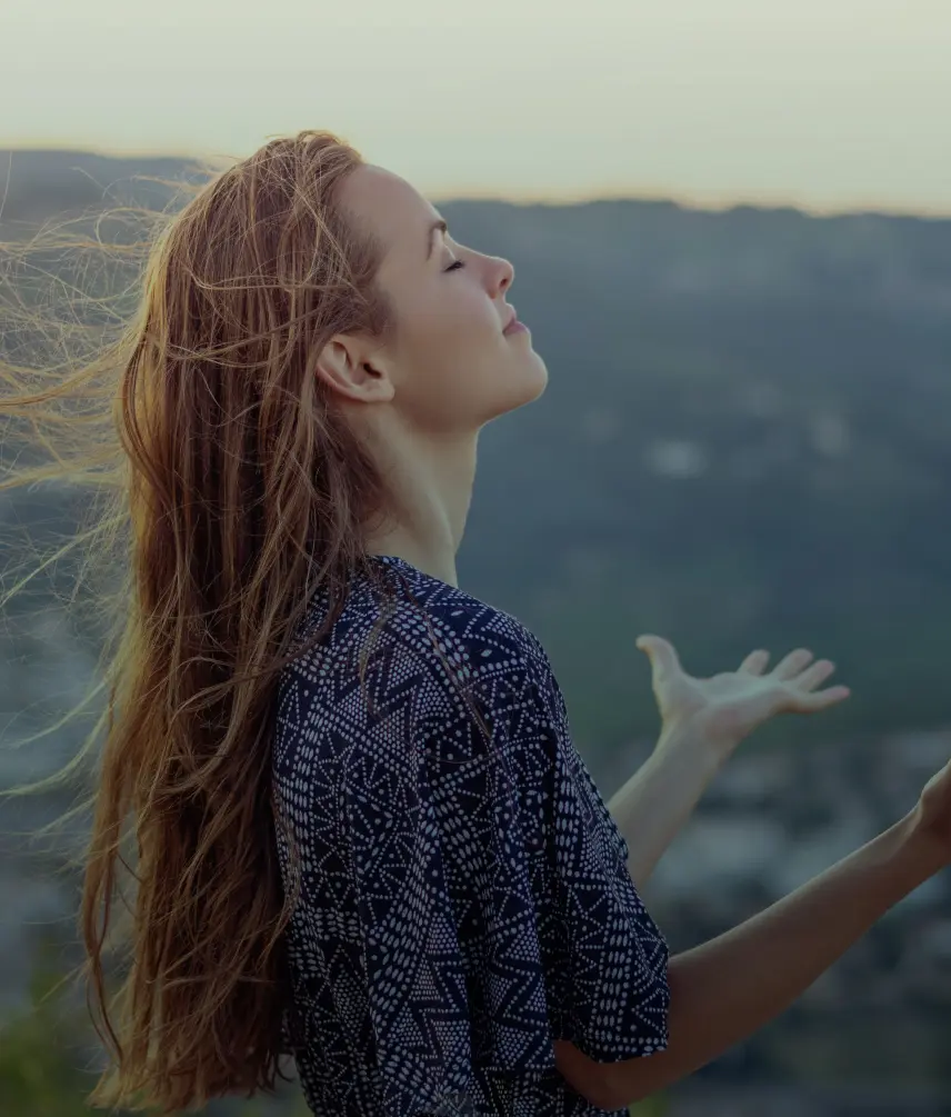 woman with closed eyes and open palms new beginnings